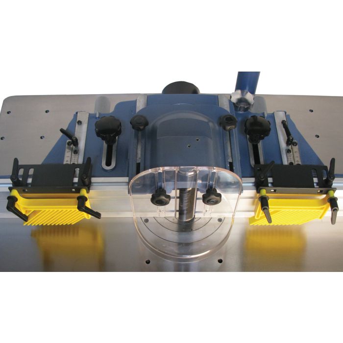adjustable fence with feather board hold downs and clear view spindle guard
