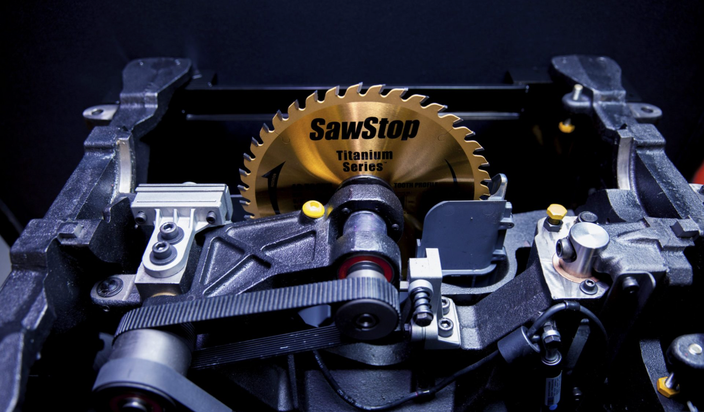SawStop table removed from saw cabinet showing off the heavy-duty trunnion system, arbor, and drive