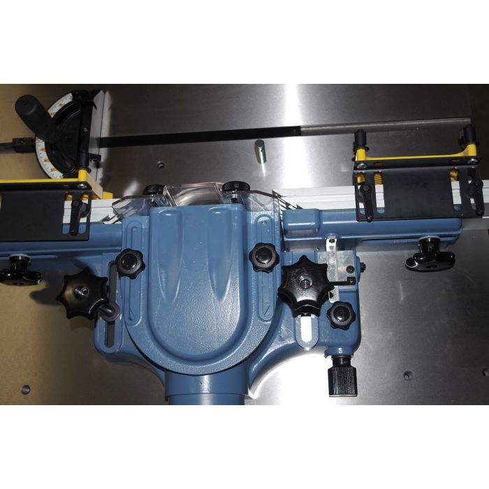 adjustable fence with feather board hold downs, miter gauge, and clear view spindle guard